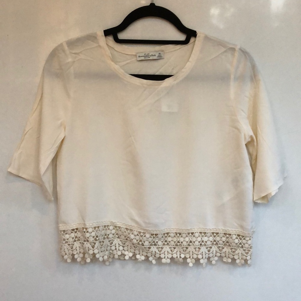 Cream crop top with crocheted bottom